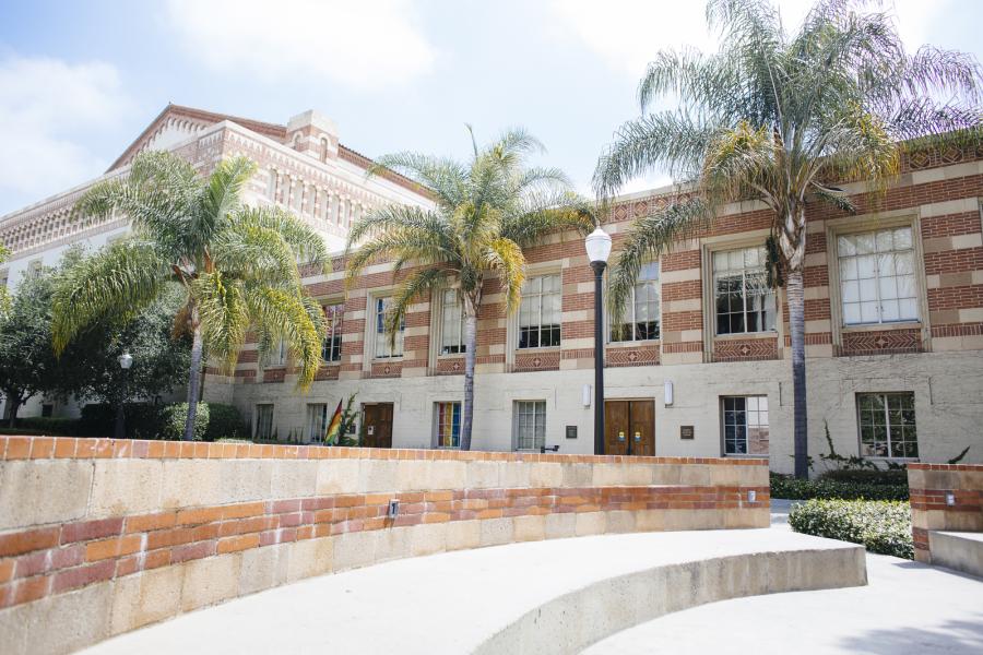 view of SAC building with palm trees in front in Bruin Plaza